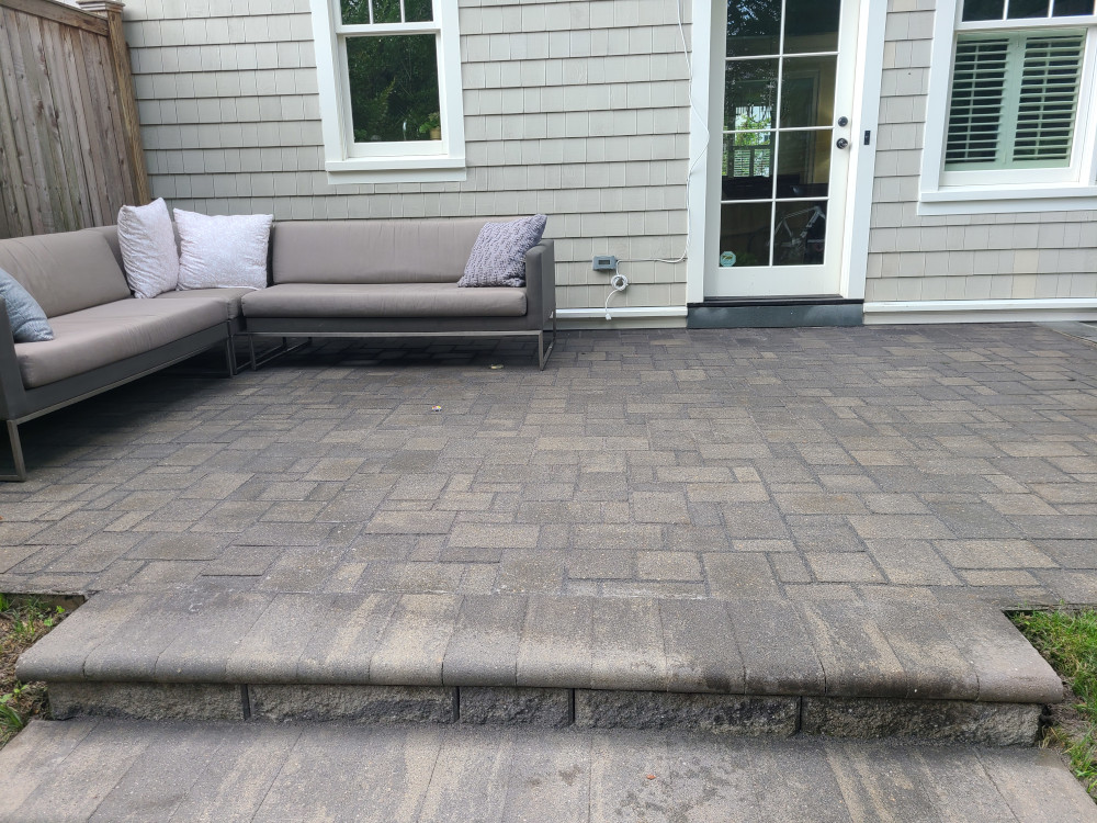 Gray backyard patio with sofa