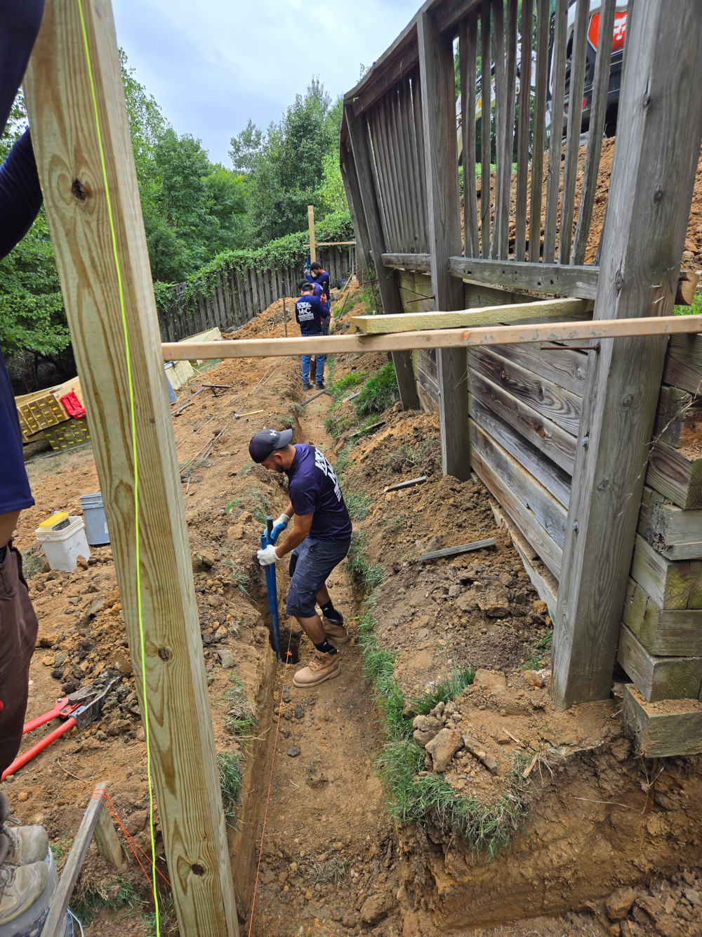 Construction workers laying foundation